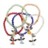 Bracelet grains semi cristal couleurs assorties sur élastique Ø 4 mm avec petit ange en résine.