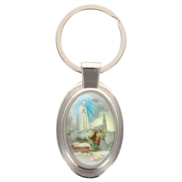 Porte-clés en métal de couleur argenté de forme ovale H. 4.3 cm. Livré en boite cadeaux. Existe avec différents Saints.