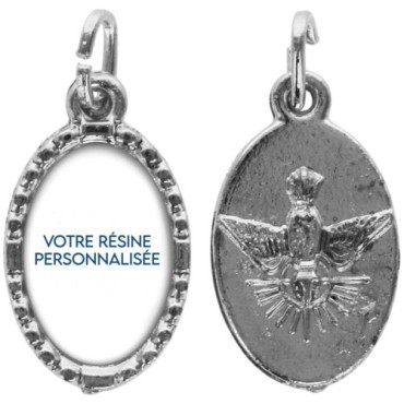 Médaille ovale métal argenté, rebord torsadé, résine. H : 1,5 cm. Différents Saints disponibles.