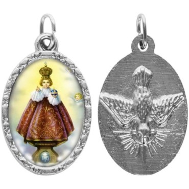 Médaille ovale métal argenté, rebord torsadé, résine. H : 2,5 cm. Différents Saints disponibles.