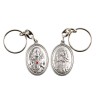 Porte-clés H. 3,7 cm en métal couleur argentée forme ovale double face, plusieurs saints..