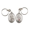 Porte-clés H. 3,7 cm en métal couleur argentée forme ovale double face, plusieurs saints..