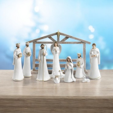 Crèche en résine de 11 personnages avec cabane H. 19.5 - 26 cm - L. 36 cm.