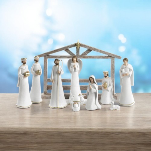 Crèche en résine de 11 personnages avec cabane H. 19.5 - 26 cm - L. 36 cm.
