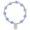 Bracelet dizainier sur élastique pour enfant avec grains œil de chat Ø 6 mm et médaille en métal de la Vierge Miraculeuse.