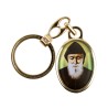 Porte-cles en metal couleur doree H. 3,8 cm avec resine couleur des saints.