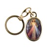 Porte-cles en metal couleur doree H. 3,8 cm avec resine couleur des saints.