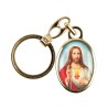Porte-cles en metal couleur doree H. 3,8 cm avec resine couleur des saints.