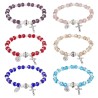 Bracelet sur élastique grains en verre Ø 8 mm avec médaille et croix. LOT DE 6 BRACELETS ASSORTIS.