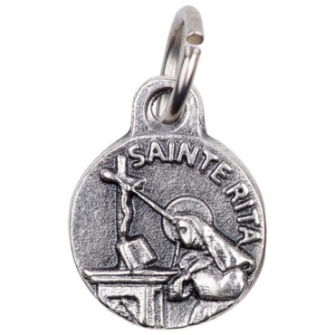 Médaille moulée en métal couleur argentée Ø 1.2 cm. Plusieurs Saints.