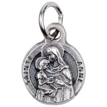 Médaille moulée en métal couleur argentée Ø 1.2 cm. Plusieurs Saints.