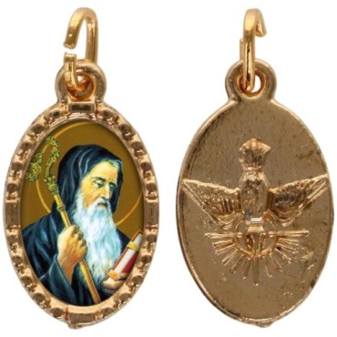 Médaille métal de couleur dorée ovale avec rebord effet dentelle H.1.5 cm avec résine. Disponible avec différents Saints.