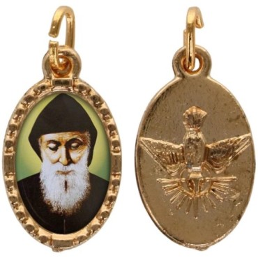 Médaille métal de couleur dorée ovale avec rebord effet dentelle H.1.5 cm avec résine. Disponible avec différents Saints.