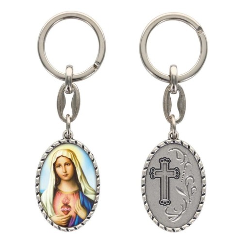 Porte-clés en aluminium de couleur argenté hauteur 3,8 cm, avec résine. Disponible avec plusieurs saints au choix.