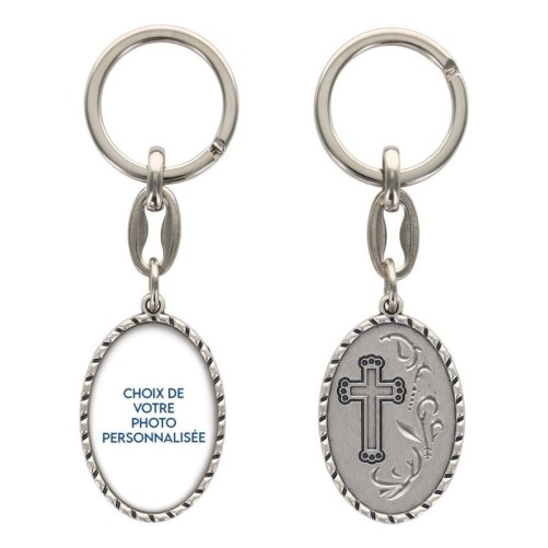 Porte-clés en aluminium de couleur argenté hauteur 3,8 cm, avec résine. Disponible avec plusieurs saints au choix.