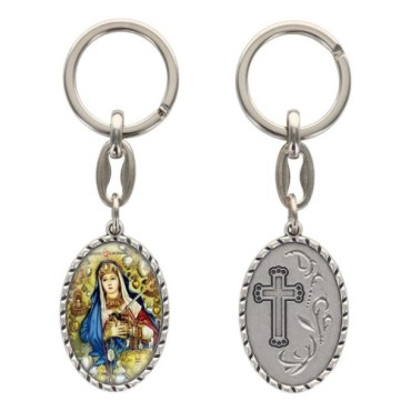 Porte-clés en aluminium de couleur argenté hauteur 3,8 cm, avec résine. Disponible avec plusieurs saints au choix.
