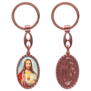 Porte-clés en aluminium de couleur cuivrée, hauteur 3,8 cm, avec résine. Disponible avec plusieurs saints au choix.