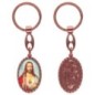 Porte-clés en aluminium de couleur cuivrée, hauteur 3,8 cm, avec résine. Disponible avec plusieurs saints au choix.
