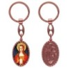 Porte-clés en aluminium de couleur cuivrée, hauteur 3,8 cm, avec résine. Disponible avec plusieurs saints au choix.
