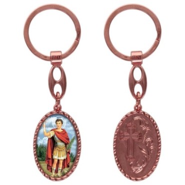Porte-clés en aluminium de couleur cuivrée, hauteur 3,8 cm, avec résine. Disponible avec plusieurs saints au choix.