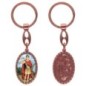 Porte-clés en aluminium de couleur cuivrée, hauteur 3,8 cm, avec résine. Disponible avec plusieurs saints au choix.