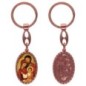 Porte-clés en aluminium de couleur cuivrée, hauteur 3,8 cm, avec résine. Disponible avec plusieurs saints au choix.