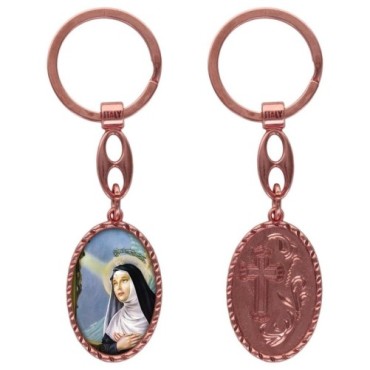 Porte-clés en aluminium de couleur cuivrée, hauteur 3,8 cm, avec résine. Disponible avec plusieurs saints au choix.
