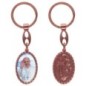 Porte-clés en aluminium de couleur cuivrée, hauteur 3,8 cm, avec résine. Disponible avec plusieurs saints au choix.