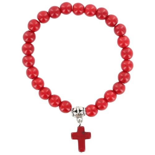 Bracelet sur elastique en turquoise synthetique Ø 7 mm avec croix.