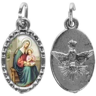 Médaille métal de couleur argentée ovale avec rebord effet dentelle H.1,5 cm avec résine. Disponible avec différents Saints.