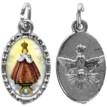 Médaille métal de couleur argentée ovale avec rebord effet dentelle H.1,5 cm avec résine. Disponible avec différents Saints.