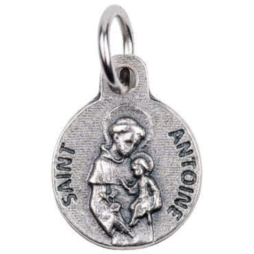 Médaille moulée en métal couleur argentée Ø 1.2 cm. Plusieurs Saints.