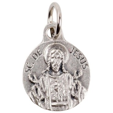Médaille moulée en métal couleur argentée Ø 1.2 cm. Plusieurs Saints.