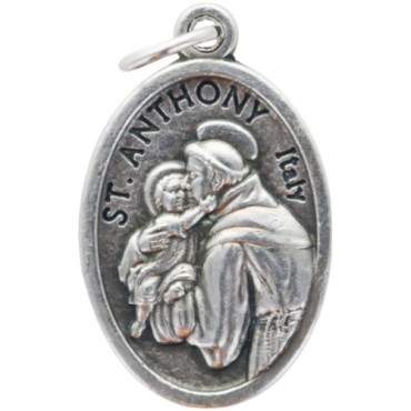 Médaille en métal couleur argentée forme ovale H. 2,2 cm. Plusieurs saints.