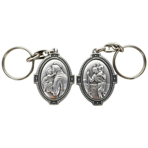 Porte-clés ovale en métal argenté, H. 4,5 cm, style croix, double face.