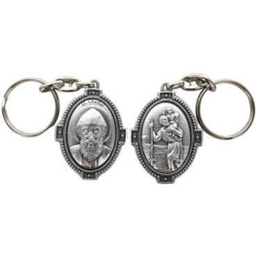 Porte-clés H. 4.5 cm en métal couleur argentée forme ovale double face, plusieurs saints..