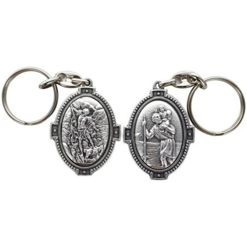 Porte-clés ovale en métal argenté, H. 4,5 cm, style croix, double face.