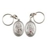 Porte-clés H. 3,7 cm en métal couleur argentée forme ovale double face, plusieurs saints..