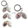 Porte-clés médaille de saint Benoit en métal couleur argentée ouvrant H. 4,5 cm double résine.