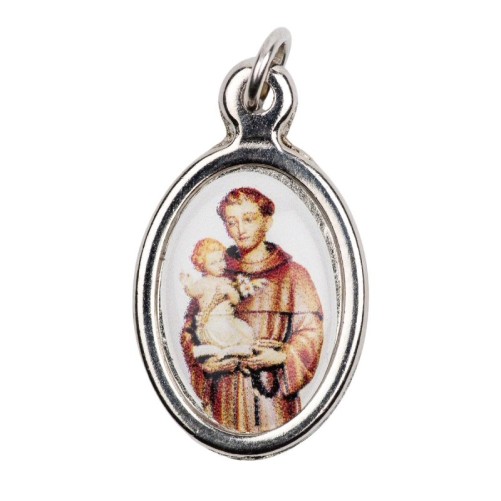 Medaille metal couleur argentee ovale H.1,5 cm avec resine, plusieurs saints.