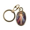 Porte-cles en metal couleur doree H. 3,8 cm avec resine couleur des saints.