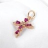 Croix de cou en laiton de couleur dorée avec pierres OZ de couleur rouge et blanc, H 1.6 cm.