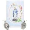 Medaille metal couleur argentee forme ovale H. 2,2 cm dans pochette avec image. Plusieurs saints