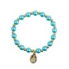 Bracelet sur elastique couleur doree grains imitation nacre Ø 7 mm, medaille Vierge Miraculeuse.