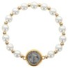 Bracelet sur élastique avec médaille de St Benoit dorée