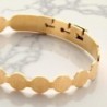 Bracelet de St Benoit réglable en acier inoxydable dorée Ø 7 mm .