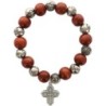 Bracelet dizainier sur élastique grains bois et grains forme rose Ø 1 cm croix métal.
