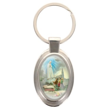 Porte-clés en métal de couleur argenté de forme ovale H. 4.3 cm. Livré en boite cadeaux. Existe avec différents Saints.