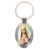 Porte-clés en métal de couleur argenté de forme ovale H. 4.3 cm. Livré en boite cadeaux. Existe avec différents Saints.