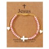 Bracelet sur corde réglable grains de forme cylindrique avec croix et coeur en coquille naturelle.